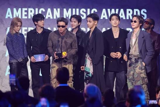 Award-winning artist BTS thanking supporters after receiving industry recognition.